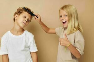 Cute stylish children posing with a comb childhood unaltered photo