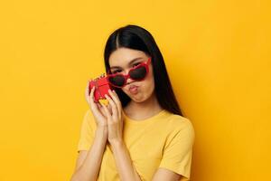 woman with Asian appearance with gift boxes in hands fun posing studio model unaltered photo