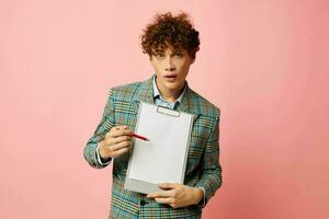 guy with red curly hair in a plaid jacket copy-space folder isolated background unaltered photo