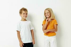 Boy and girl fun gestures with hands emotions childhood lifestyle unaltered photo