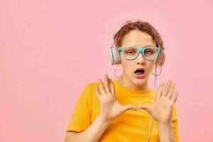 pretty girl wearing blue glasses listening to music on headphones cropped view unaltered photo