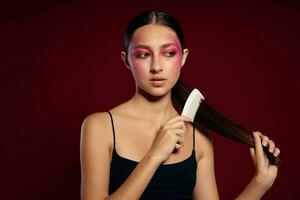 woman combing hair hairstyle care close-up photo