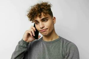 handsome guy with a phone in hand communication isolated background photo