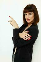 beautiful woman in a black jacket red nail polish posing Lifestyle unaltered photo