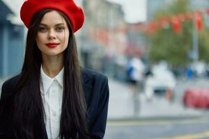 Woman smile walks walks in the city against the backdrop of office buildings, stylish fashionable vintage clothes and make-up, autumn walk, travel. photo