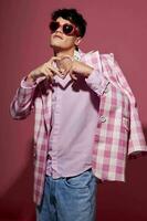 handsome guy self confidence pink plaid blazer fashion posing pink background unaltered photo