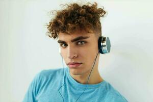 handsome guy in blue t-shirts headphones fashion Lifestyle unaltered photo