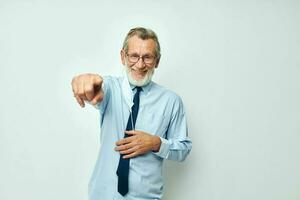 Senior grey-haired man in shirt with tie medical mask safety isolated background photo