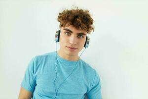 Attractive man in blue t-shirts headphones fashion isolated background photo