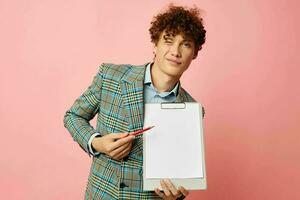 guy with red curly hair folder for papers blank sheet posing in suit isolated background unaltered photo