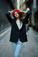 Fashion woman portrait walking tourist in stylish clothes with red lips walking down narrow city street, travel, cinematic color, retro vintage style, dramatic look without smile sadness. photo