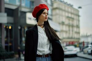 A business woman walks in the city against the backdrop of office buildings, stylish fashionable clothes and make-up, spring walk, travel. photo