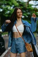 Portrait of woman brunette smile with teeth running down the street against backdrop palm trees in the tropics, summer vacations and outdoor recreation, the carefree lifestyle of a freelance student. photo