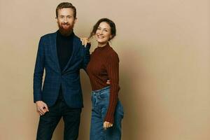 Man and woman couple in a relationship smile and interaction on a beige background in a real relationship between people photo