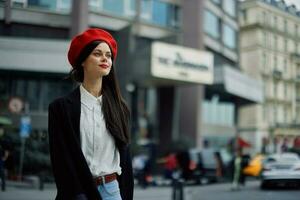 Woman smile with teeth tourist walks walks in the city on the background of office buildings, stylish fashionable clothes and make-up, spring walk, travel. photo