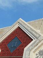 Attin grand mosque under the sunlight and a blue sky in Jakarta, Indonesia photo