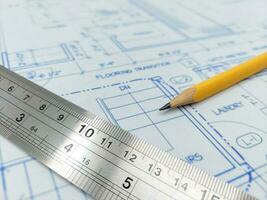 Image of several drawings of the project and instruments with ruler and pencil photo