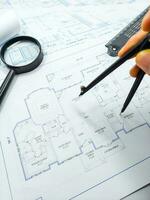 Hands of Engineer working on blueprint. Architecture interior concept. photo