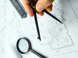 Hands of Engineer working on blueprint. Architecture interior concept. photo