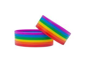 Two colorful rainbow wristband lgbtq people symbol isolated on white background with clipping path. Concept of lgbtq wristband wearing to support and attend celebration event of lgbtq photo