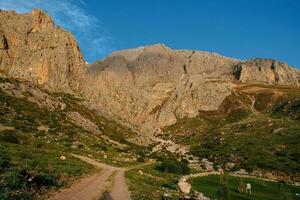 Hiking way to mountains landscape photo