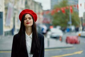 Woman smile walks walks in the city against the backdrop of office buildings, stylish fashionable vintage clothes and make-up, autumn walk, travel. photo