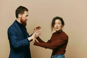 Man and woman couple in a relationship quarrel, yelling, psychological violence in the family, problems in a real relationship between people photo