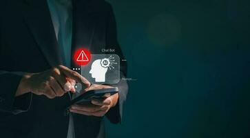 Business man using digital chatbot Artificial Intelligence AI with hacking and warning alert. cyber attack network, spyware or Malicious software. Technology cyber security and cybercrime. photo