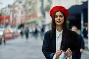 Happiness woman jumps and runs, follow me walks walks in the city against the backdrop of office buildings, stylish fashionable vintage clothes and make-up, spring walk, travel. photo