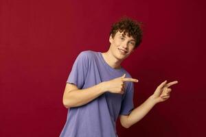 teenager fashion posing hand gestures red background unaltered photo