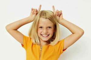 girl with blond hair gesture with hands posing close-up photo