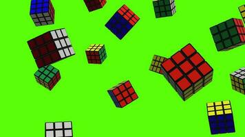 di rubik cubi sfondo. caduta multicolore di rubik cubi al di sopra di verde schermo o croma chiave. pioggia di di rubik cubi attraverso il schermo. video