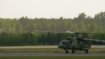 NOVOSIBIRSK, RUSSIA JUNE 17, 2020 - Military helicopter Mi 8 taxiing the runway in Novosibirsk, Tolmachevo. Military aircraft video