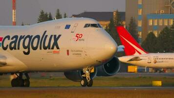 NOVOSIBIRSK, RUSSIAN FEDERATION JUNE 17, 2020 - Cargolux Airlines International cargo airline. Boeing 747 of Cargolux Airlines taxis for takeoff from Tolmachevo International Airport Novosibirsk video