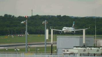 DUSSELDORF, GERMANY JULY 23, 2017 - Eurowings Airbus A320 landing and braking on the runway of Dusseldorf airportt DUS video