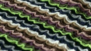 Knitted fabric background. Closeup video