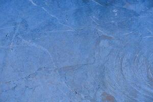Dirty blue stone wall pattern texture background. photo