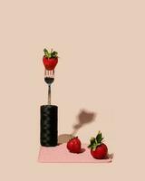 Creative shot of strawberry isolated on pink background vertical photo