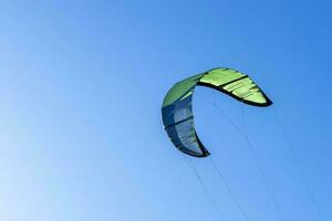 wing of kitesurfing against the blue sky . Kitesurfing on the sea photo