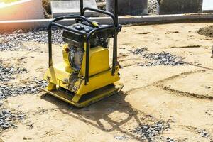 construction gasoline vibration rammer on the construction site photo