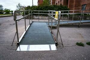 A ramp for people with disabilities near a public building. photo