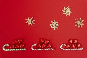 Christmas background with a sled, candy and a caramel cane photo