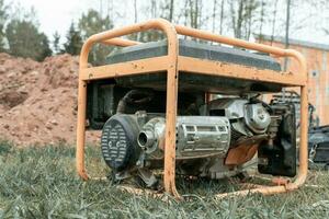 portable gasoline generator operating on a construction site photo