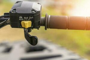 atv controls close-up. switches on the handlebar of the ATV photo