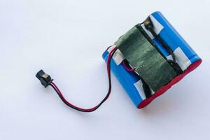 broken lithium battery pack with wires and a terminal photo