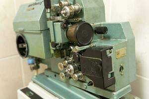 old vintage movie projector. close-up of a stylish movie projector photo