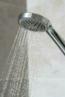 water pours from the shower head. shower-bath. Close up photo