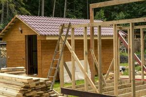 construction of a frame house. Timber frame house, new build roof photo