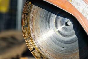 close-up of a saw with a disc for cutting concrete and paving slabs photo