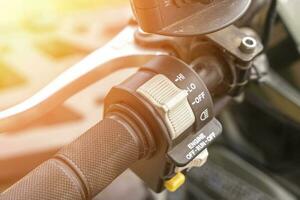 atv controls close-up. switches on the handlebar of the ATV photo